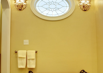 oval window following the oval motif of the doors and shower window