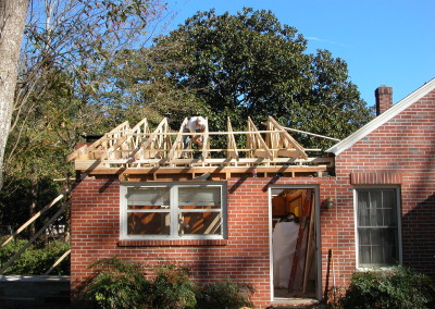 New wood trusses framing over the flat roof